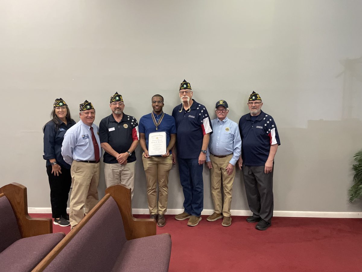 Pictured (l to r) are Post Finance Officer Wendy Griffioen, Post Adjutant Kevin McKenzie, Post Commander Ray Chavaree, Jacoby Johnson, Executive Committeeman Michael Griffioen, Legionnaire Dr. Paul Taylor, and Legionnaire and Oratorical Emeritus Charlie Martinek.