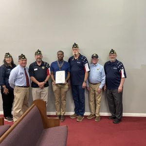 Pictured (l to r) are Post Finance Officer Wendy Griffioen, Post Adjutant Kevin McKenzie, Post Commander Ray Chavaree, Jacoby Johnson, Executive Committeeman Michael Griffioen, Legionnaire Dr. Paul Taylor, and Legionnaire and Oratorical Emeritus Charlie Martinek.