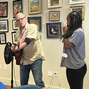 Student playing harmonica during workshop. (Photo Credit: Special to The Pass Post)