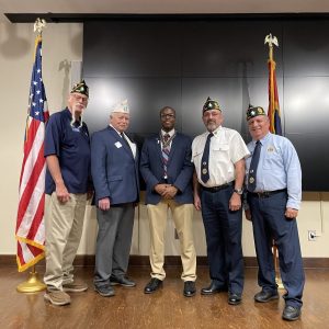Pictured (l to r) are:Executive Committeeman Mike Griffioen, Department Commander David Benson, Pass Christian High School senior Jacoby Johnson, Commander Ray Chavaree and Adjutant Kevin McKenzie.