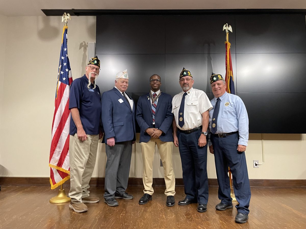 Pictured (l to r) are:Executive Committeeman Mike Griffioen, Department Commander David Benson, Pass Christian High School senior Jacoby Johnson, Commander Ray Chavaree and Adjutant Kevin McKenzie.