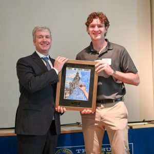 : Gus Simpson (right), pictured with Mississippi Treasurer David McRae (left), won first place and a $1,000 scholarship in the Mississippi College and Career Savings Art Contest.
