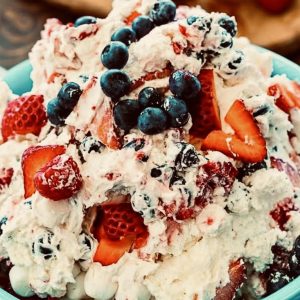 Berry Patriotic Cheesecake Fluff Salad is the easiest possible dessert to make for a Fourth of July gathering, but you wouldn’t know that from the creamy, delicious taste.