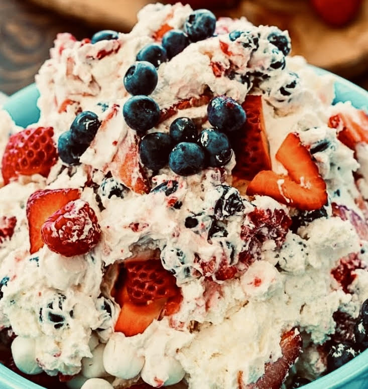 Berry Patriotic Cheesecake Fluff Salad is the easiest possible dessert to make for a Fourth of July gathering, but you wouldn’t know that from the creamy, delicious taste. 