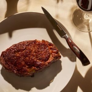 This recipe isn’t actually used by Delmonico’s in New York City to create their famous steaks, one of which is pictured here, but the recipe does use the Delmonico cut of steak and is delicious in its own way. (Photo credit: Giada Paoloni for Delmonico's).