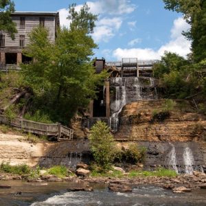 Dunn's Falls Water Park in Enterprise, MS, is one of the most scenic (and coolest!) places to visit during the summer.
