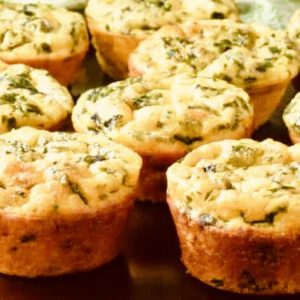 Hearty egg muffins filled with spinach and cheese (or favorite protein like bacon or ham) are easy to eat on the go and are a healthy breakfast option.