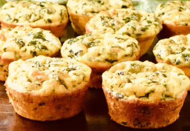 Hearty egg muffins filled with spinach and cheese (or favorite protein like bacon or ham) are easy to eat on the go and are a healthy breakfast option.