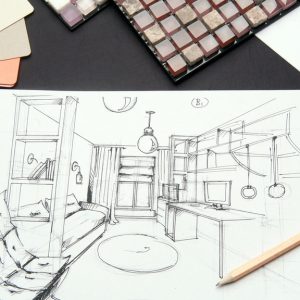 A table with an interior design rendering and paint swatches to the left. There's a pencil laying on the rendering.