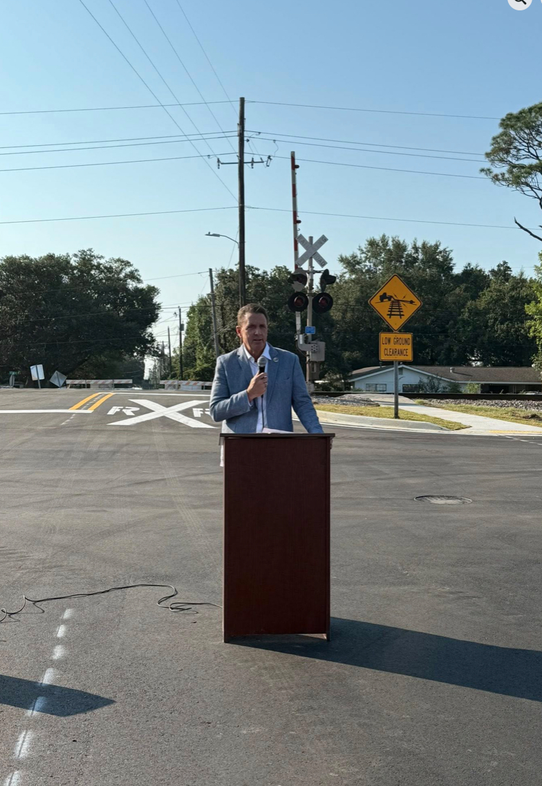 : Long Beach Mayor Tim Pierce addresses the crowd at the September 12 ribbon cutting celebrating (at press time) the near-completion of the $3.3 million Rail Crossing Grade Improvement Project. (Photo credit: Special to Long Beach Breeze)