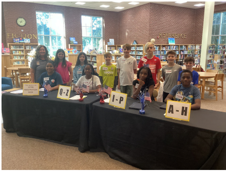 Pictured Above: Mrs. Charlene Stephens and her 6th Grade World History students helping to set upand work the mock election at Pass Christian Middle School.