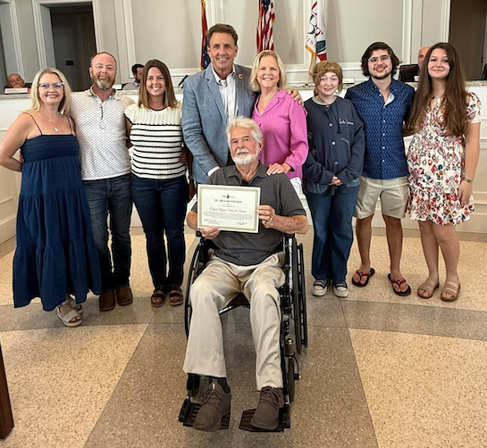 : Long Beach Mayor Tim Pierce and the Board of Aldermen recently honored Chuck Ryan (center) and his family for their decades of dedication and service in the local community.