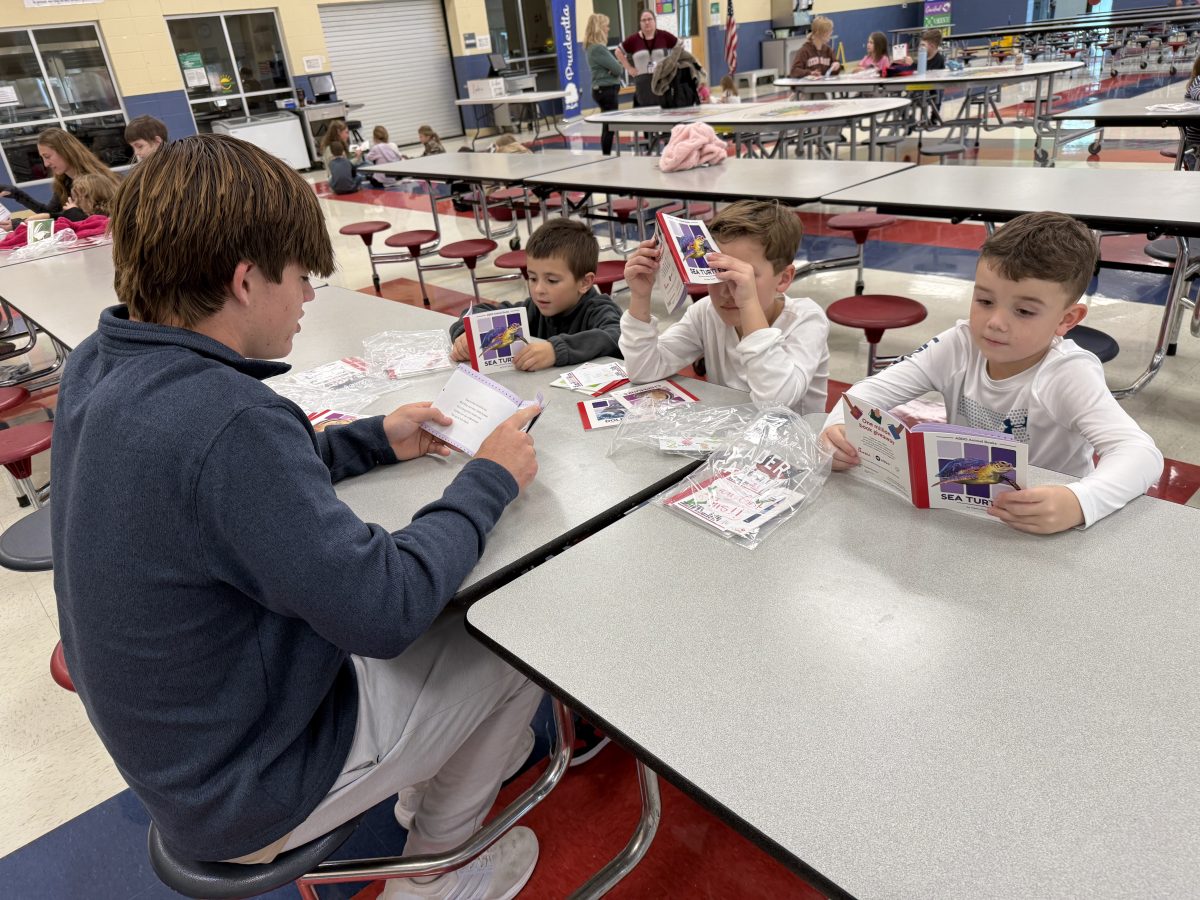 Stone Kelly reading with elementary students