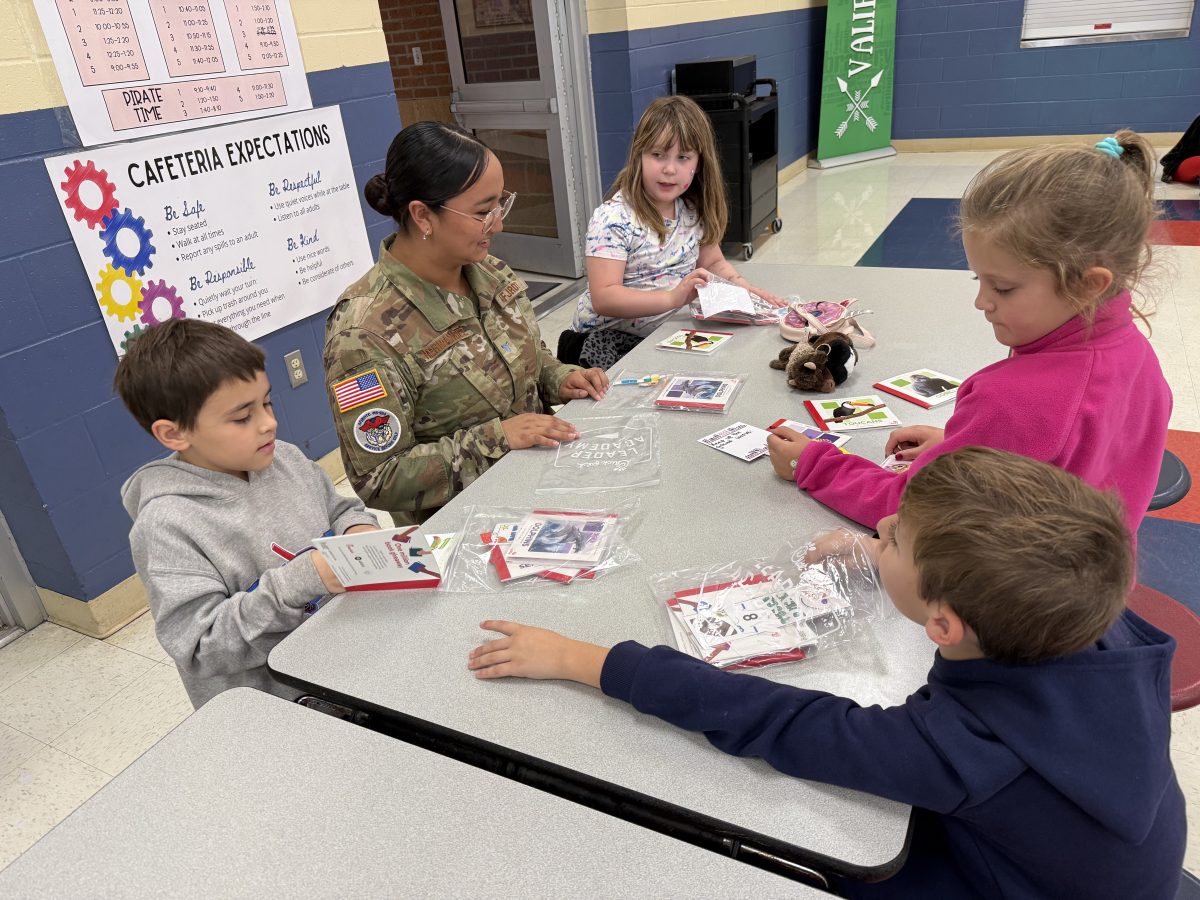 Keily Hernandez reading with elementary students