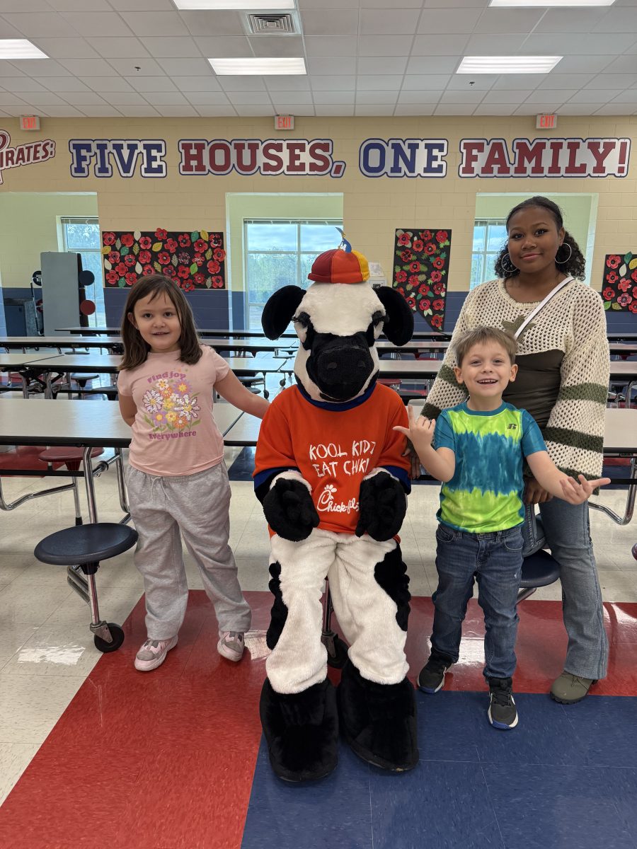Faith Kennedy with DES students and Chick-fil-a cow