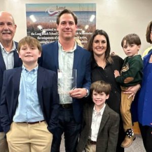 Patrick Bennett (center), who also serves on the Long Beach Board of Aldermen, representing Ward 1, has been named Administrator of the Year by the Long Beach School District. He is pictured surrounded by his family.