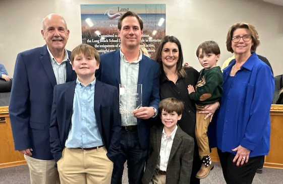 Patrick Bennett (center), who also serves on the Long Beach Board of Aldermen, representing Ward 1, has been named Administrator of the Year by the Long Beach School District. He is pictured surrounded by his family. 