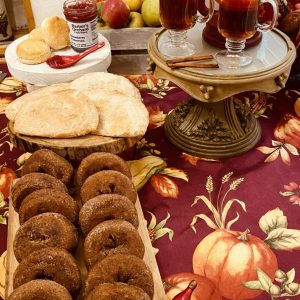 My carry-on suitcase was filled with delicacies from Barber Orchards and Bakery in Waynesville, NC. Back home, I created the perfect brunch that included, clockwise from bottom left: apple cider doughnuts, apple tarts, Barber’s strawberry preserves (and my homemade biscuits), apples I picked myself from a Waynesville apple orchard and hot apple cider.