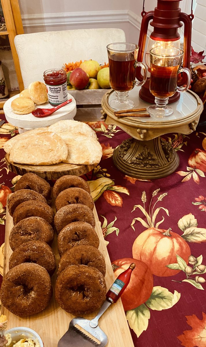 My carry-on suitcase was filled with delicacies from Barber Orchards and Bakery in Waynesville, NC. Back home, I created the perfect brunch that included, clockwise from bottom left: apple cider doughnuts, apple tarts, Barber’s strawberry preserves (and my homemade biscuits), apples I picked myself from a Waynesville apple orchard and hot apple cider. 