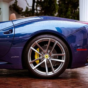 close up of back end of blue sports car