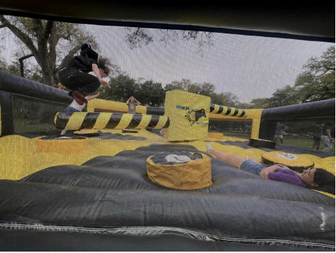 Students taking on the Wipeout Inflatable to unlock their inner Ninja Warrior