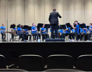 Pictured Above: Member of the PCMS advanced band performing at Biloxi High School in the prestigious Gulf Coast Band Directors Association Concert Festival.