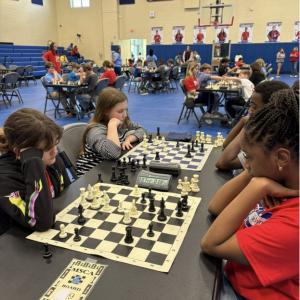 Student participating in the district wide chess tournament