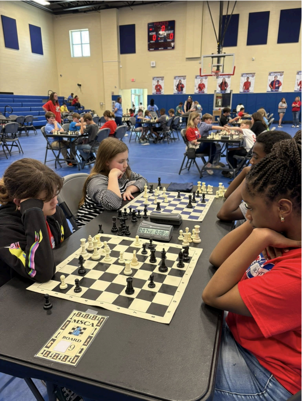  Student participating in the district wide chess tournament