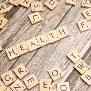 HEALTH spelled with scrabble letters on a table