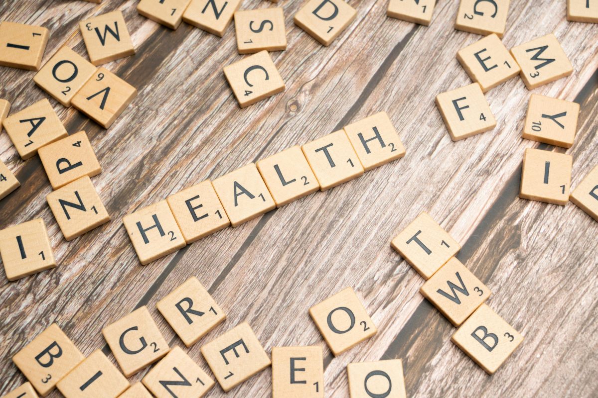 HEALTH spelled with scrabble letters on a table