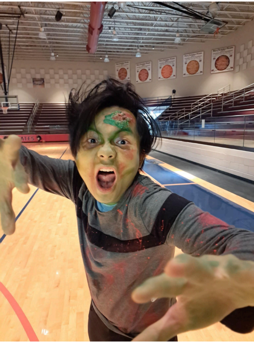 Sophomore Kobe Vu getting into character at dress rehearsa