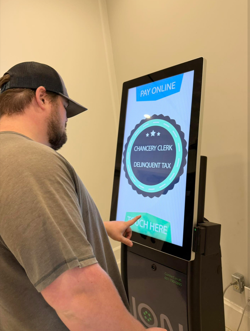 Located on the first floor inside the lobby of Long Beach City Hall at 201 Jeff Davis Avenue, the kiosk allows residents and others to pay a variety of City-related fees without waiting in line during regular office hours. Services available through the machine include paying delinquent taxes, car tag renewals and more.