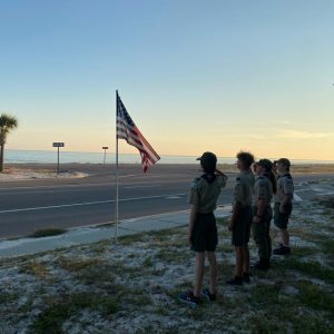 Members of Boy Scouts Troop 321 salute the American flag. This is one of many flags Boy Scouts with this local troop put up throughout the City of Long Beach for Memorial Day.