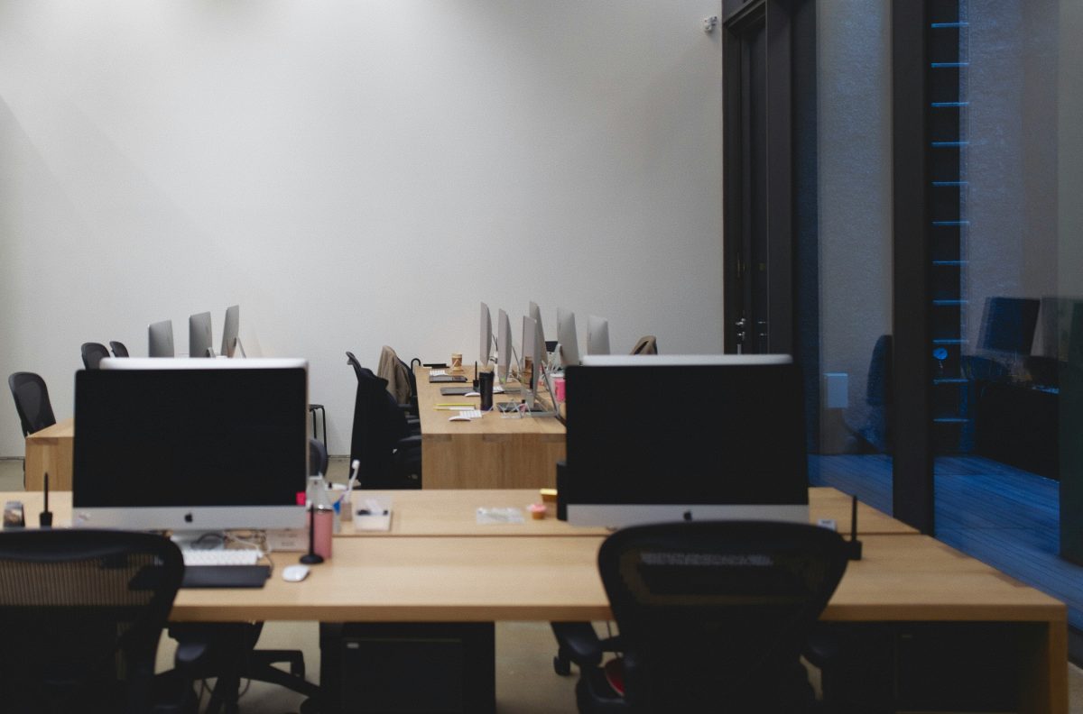 a computer lab with desks and computer monitors