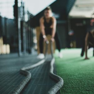 two people in a gym working out