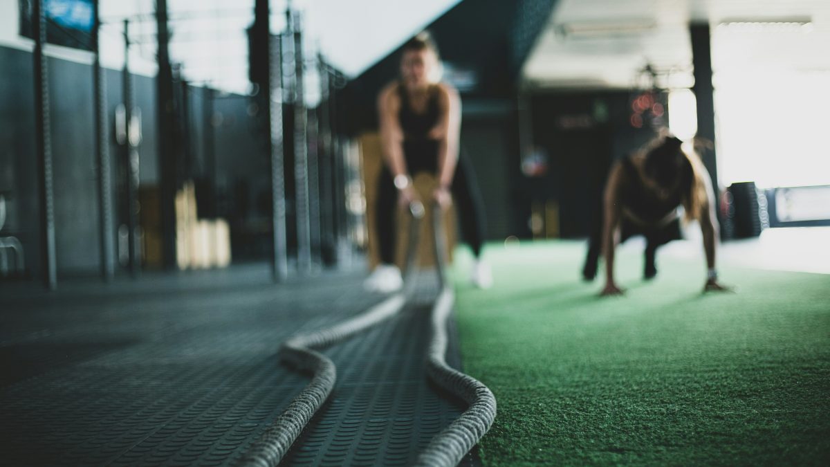 two people in a gym working out