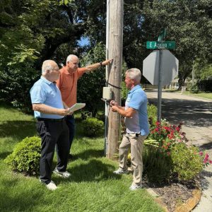Members of the newly-formed Ward 3 Streetlighting Review Task Force, Long Beach Ward 3 Alderman Joey Giuffria (center) along with resident volunteers Jim Schloegel (left), a utility company retiree, and Keith Clark (right), assess streetlights and their usage in the Ward 3 area of East Azalea Drive in Long Beach. (Photo caredit: Toni Miles)