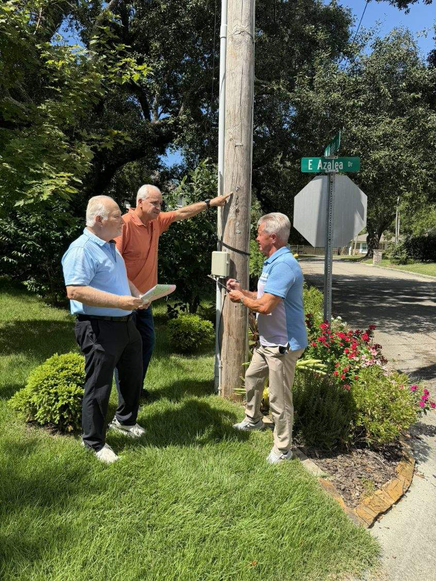 Members of the newly-formed Ward 3 Streetlighting Review Task Force, Long Beach Ward 3 Alderman Joey Giuffria (center) along with resident volunteers Jim Schloegel (left), a utility company retiree, and Keith Clark (right), assess streetlights and their usage in the Ward 3 area of East Azalea Drive in Long Beach. (Photo caredit: Toni Miles)