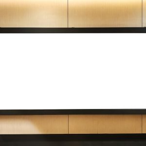 A large, blank horizontal billboard with a black frame is mounted on a wooden wall in a modern indoor hallway.