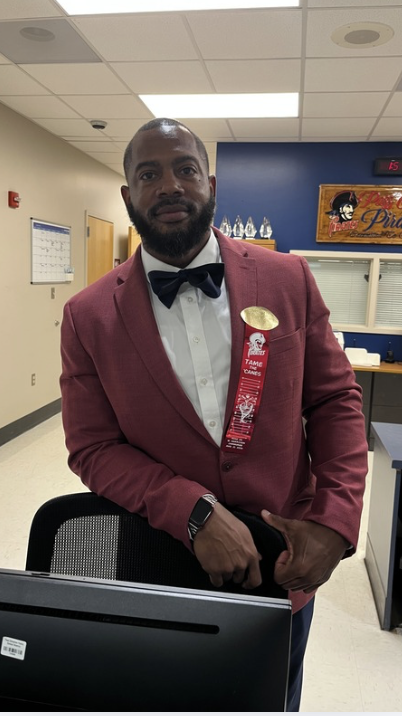 Assistant Principal, Dr. Joe Smith, sporting the first home game ribbon at the PCHSfront office.