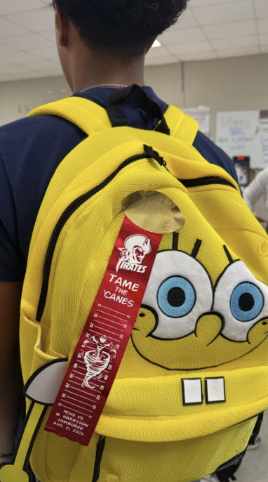 A PCHS student wearing a spirit ribbon on his back pack.