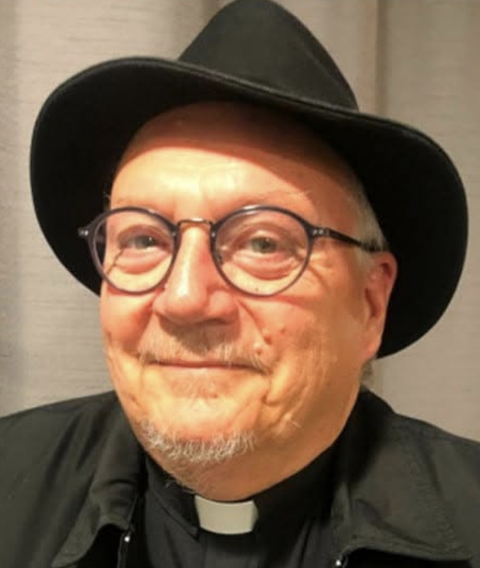 Father Martin J. Gillespie, Pastor of St. Mary Catholic Church, in his role as the Godfather in the 2022 Murder Mafia Mystery Dinner fundraiser.