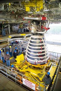 Teams at NASA's Stennis Space Center deliver, lift, and install the first new production on RS-25 engine on the Fred Haise Test Stand on February 18, 2025 (NASA/ Danny Nowlin)