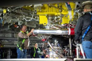 Teams at NASA's Stennis Space Center deliver, lift, and install the first new production on RS-25 engine on the Fred Haise Test Stand on February 18, 2025 (NASA/ Danny Nowlin)